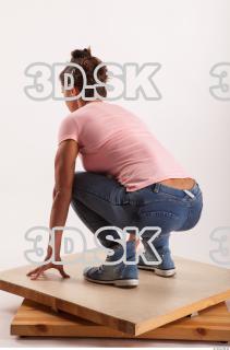 Kneeling pose blue jeans pink t shirt of Oxana …